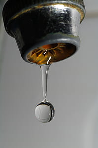 time lapse photography of gray faucet with water droplet thumbnail