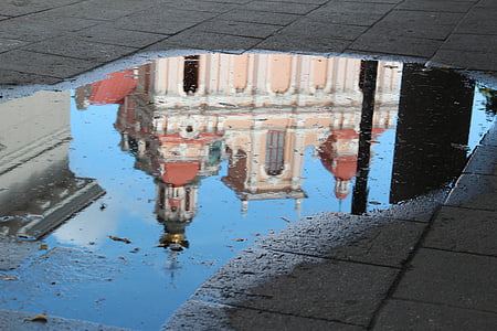water reflection of white and pink building thumbnail