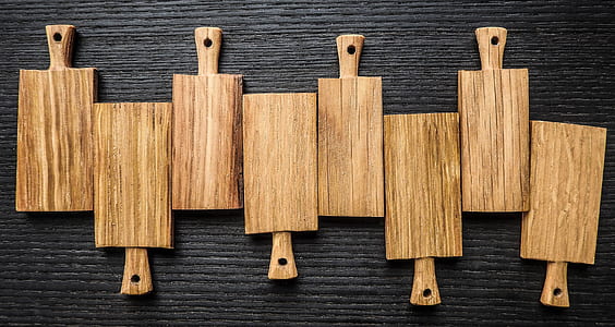 eight brown wooden chopping boards thumbnail