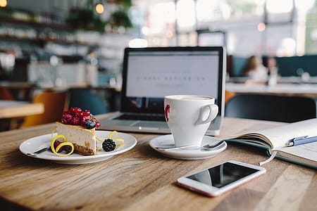 Working in a restaurant: Macbook, Cheese Cake and Cup of Coffee thumbnail