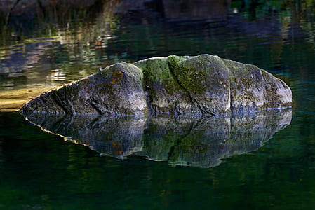 stone between body of water thumbnail