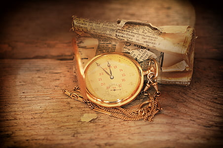 gold-colored pocket watch thumbnail