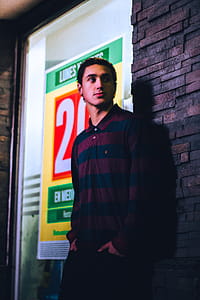 Man Wearing Blue and red Striped Collared Half-button Long-sleeved Shirt thumbnail