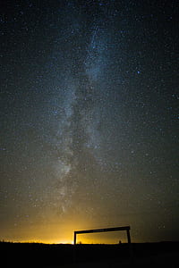 silhouette photography of post under milky way thumbnail