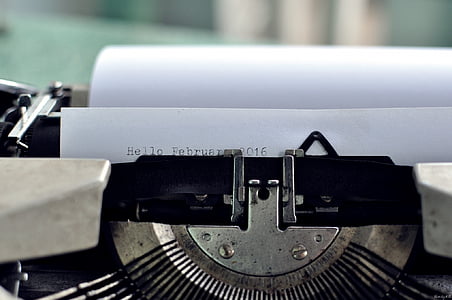 close-up photo of black typewriter with white paper thumbnail