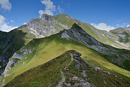 photo of green and gray mountain during cloudy daytime thumbnail