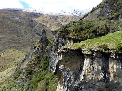green grass on gray mountain thumbnail