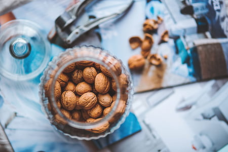 closeup photo of almonds in clear mason jar thumbnail