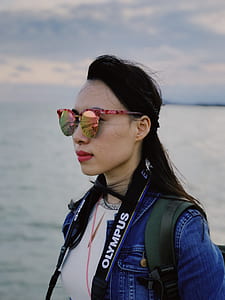 woman wearing sunglasses and jacket thumbnail