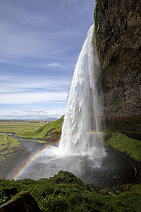 waterfalls near hill during daytime thumbnail