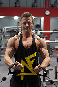 man wearing black and yellow tank top thumbnail