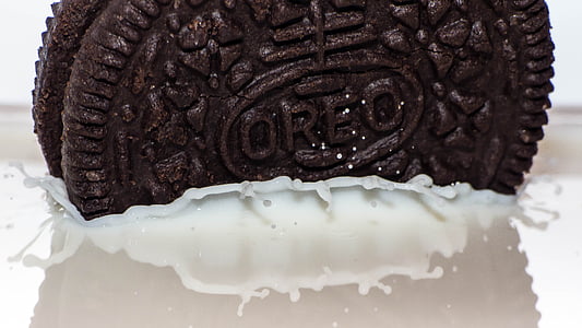 Oreo cookie dipped in milk thumbnail