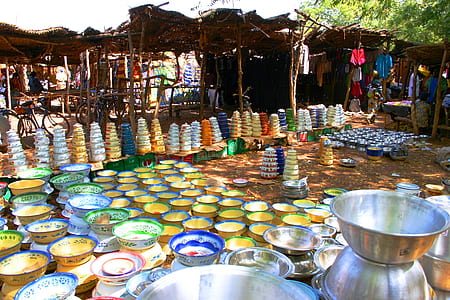 assorted-color bowls on ground during daytime thumbnail