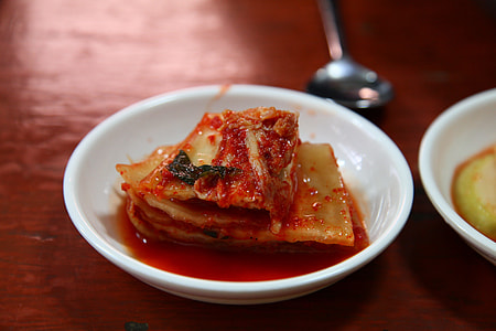 selective focus photography of kimchi on saucer thumbnail