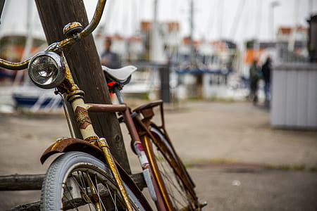 selective focus photography of bike parked on street thumbnail