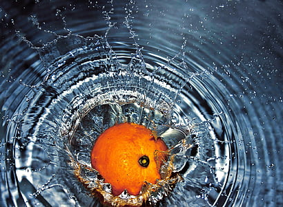 orange fruit drops on water thumbnail
