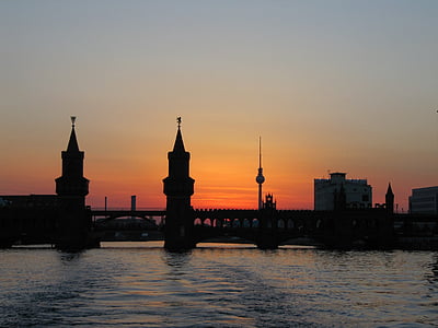 bridge and high-rise building during sunset thumbnail