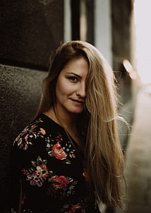 woman in black and red floral dress thumbnail