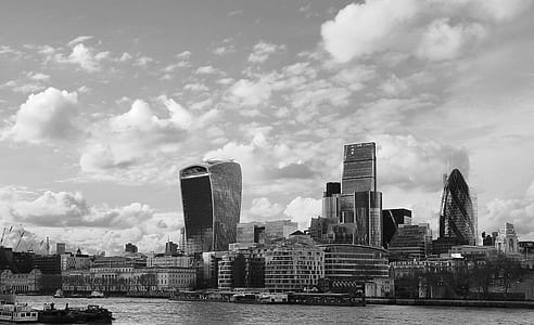 Grayscale Photo of City Near Body of Water thumbnail