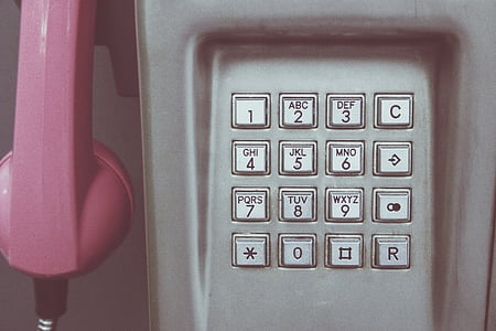 close-up photo of pink and gray telephone thumbnail