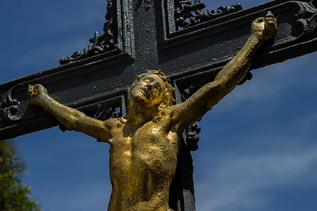 gold and black crucifix statue thumbnail