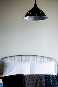 black pendant lamp on top of bed thumbnail