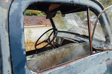 close up photography of gray wreck vehicle at daytime thumbnail