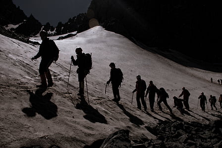 silhouette of people walking on desert thumbnail