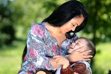 woman carrying toddler thumbnail