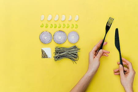 person holding fork and knife thumbnail