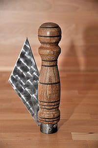 brown wooden condiments shaker on brown wooden table thumbnail