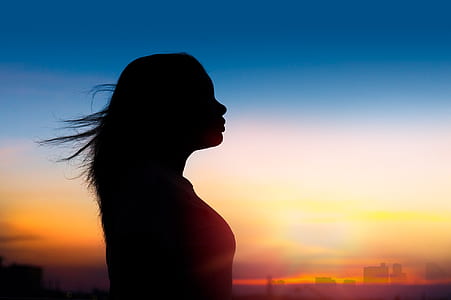 silhouette of woman taken at sunset thumbnail