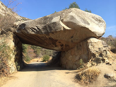 rock formation near green trees thumbnail