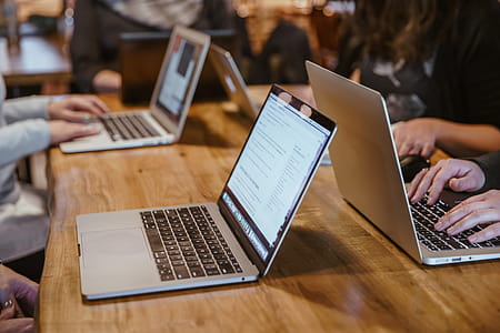 Laptops At Workstations Coding Photo thumbnail
