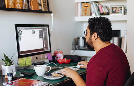 man using a silver iMac thumbnail