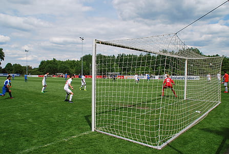 soccer player on field during daytime thumbnail