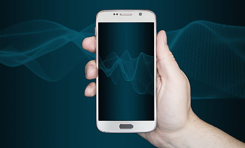 person holding Samsung Android smartphone thumbnail
