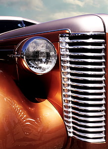 closeup photo of brown vehicle headlight thumbnail