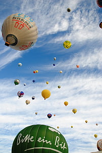 assorted-color hot air balloon lot flying near clouds at daytime thumbnail