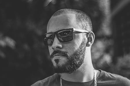 grayscale photography of man wearing sunglasses thumbnail