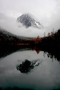 mountain covered in fog thumbnail
