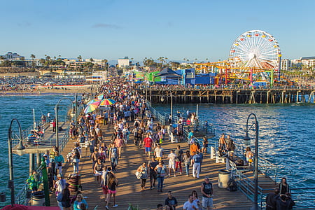 people gathered on dock under blue sky at daytime thumbnail