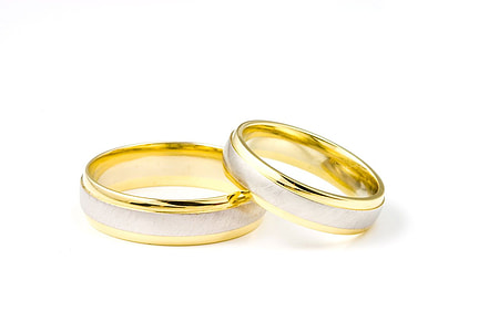 two silver-and-gold-colored bridal rings thumbnail