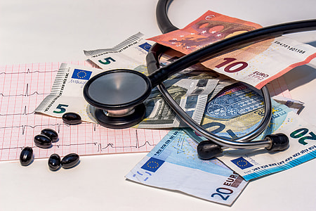 Stethoscope from doctor and cash bank notes thumbnail