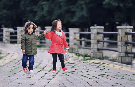 two girl's in black and red jackets thumbnail