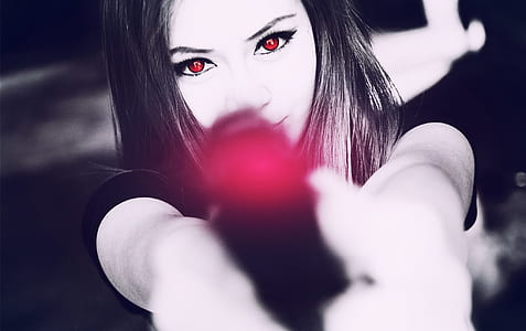 Black and White Photography of Woman Holding Pistol thumbnail
