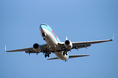 blue and white airliner during daytime thumbnail