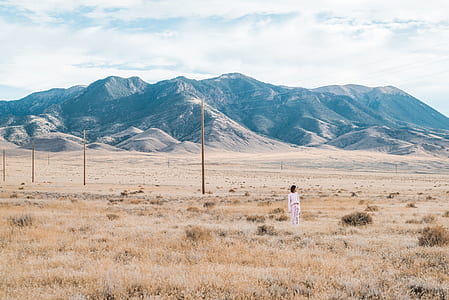 woman wearing white dress standing at daytime thumbnail