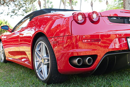selective focus photography of red convertible thumbnail