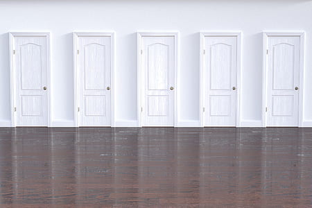 five white wooden doors on wall thumbnail